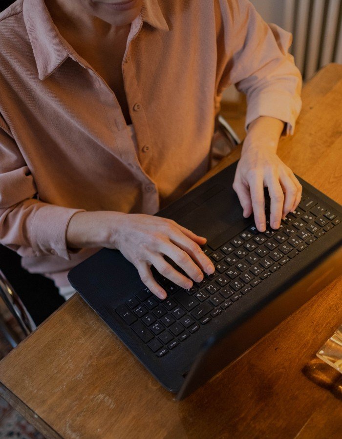 Ghostwriting A person typing on a laptop (Ghostwriter)